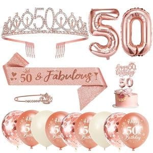 Décoration pour un anniversaire de 50 ans femme : écharpe, couronne, ballon or rose, bougies et topper gâteau